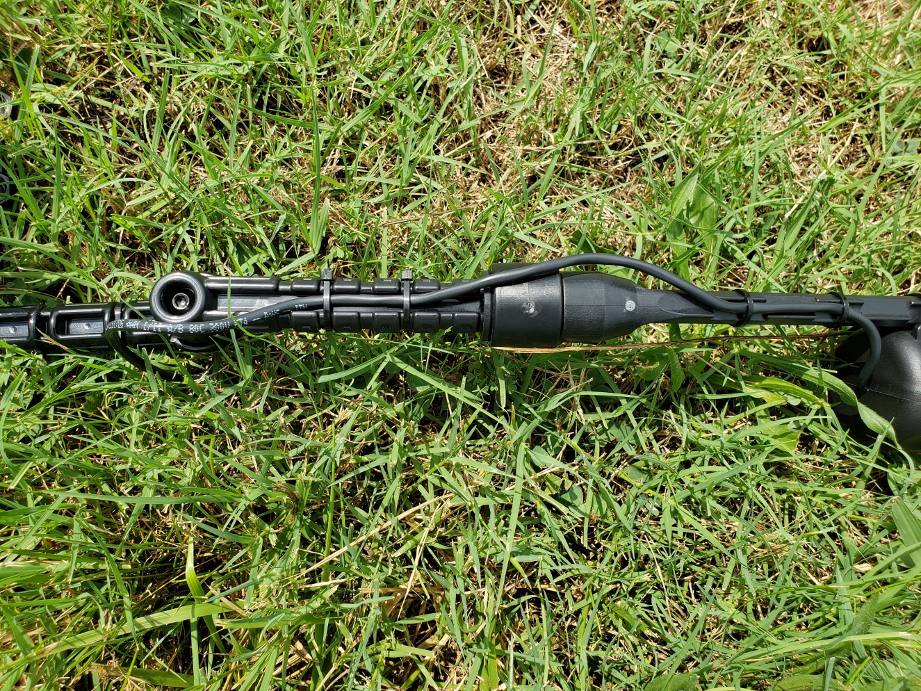 Hydrowave mini bass being mounted on a kayak