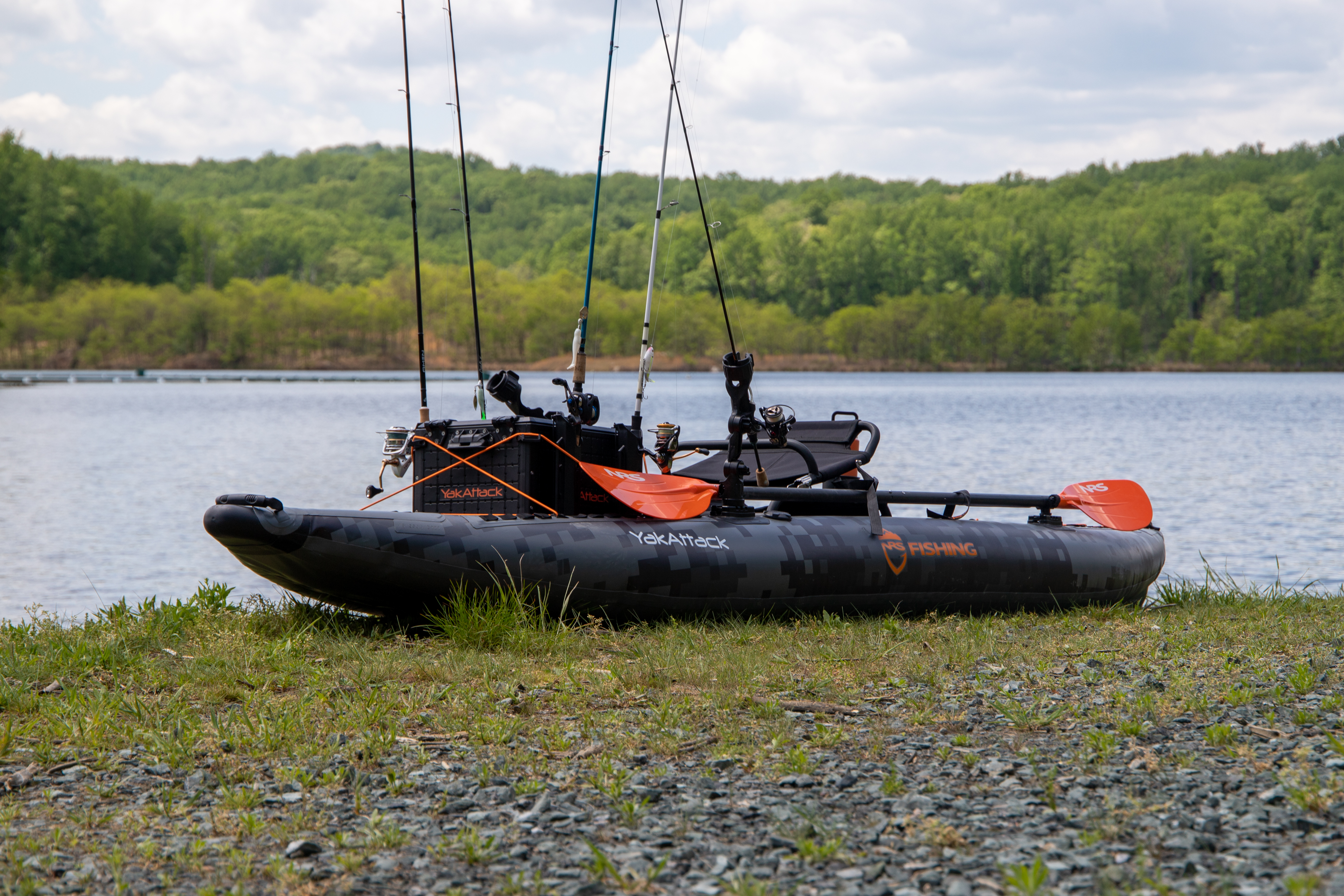 NRS Pike Pro Inflatable fishing Kayak next to Lake